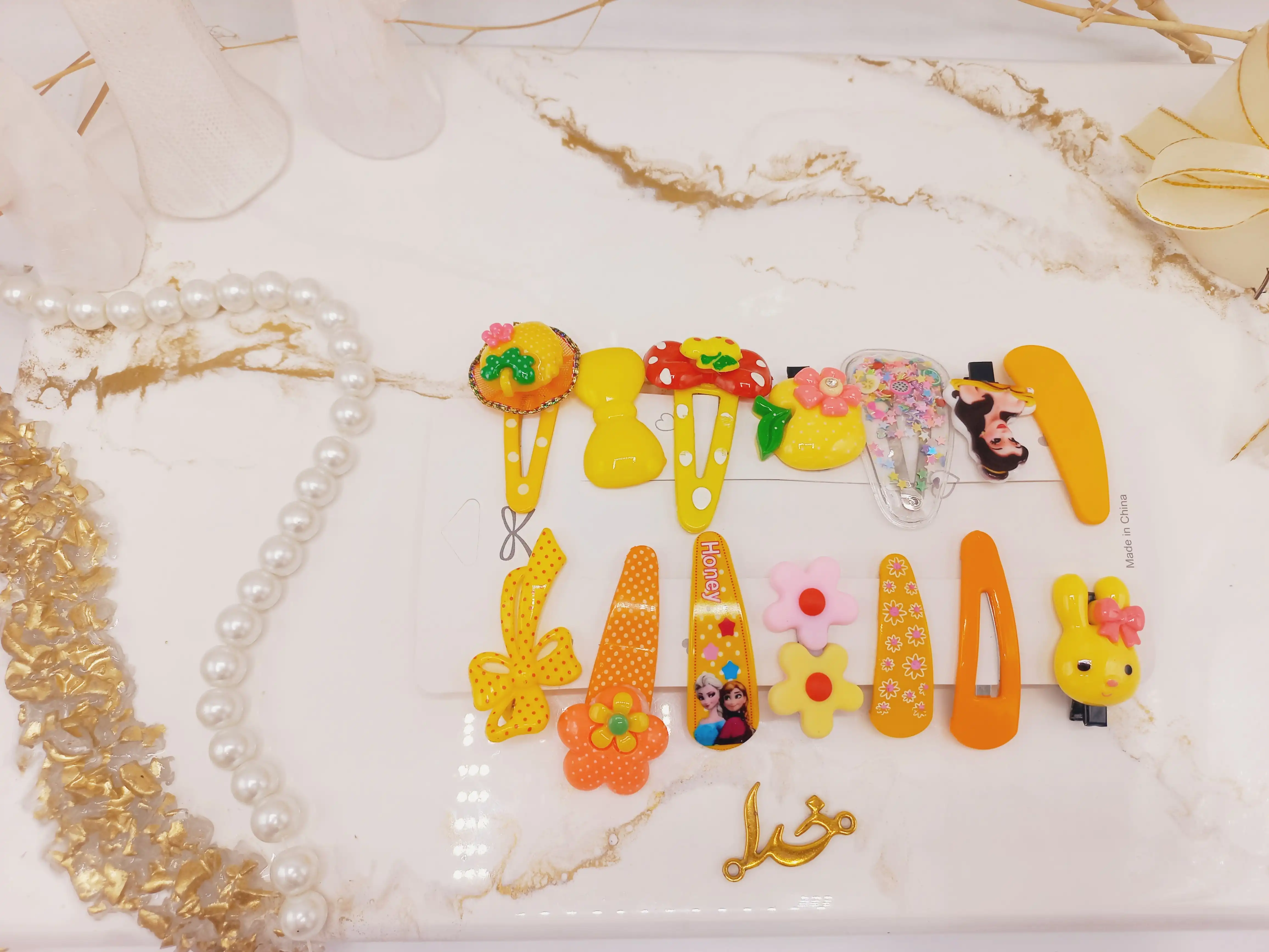 پک گیره و پنس مو دخترانه عروسکی زرد 14 عددی