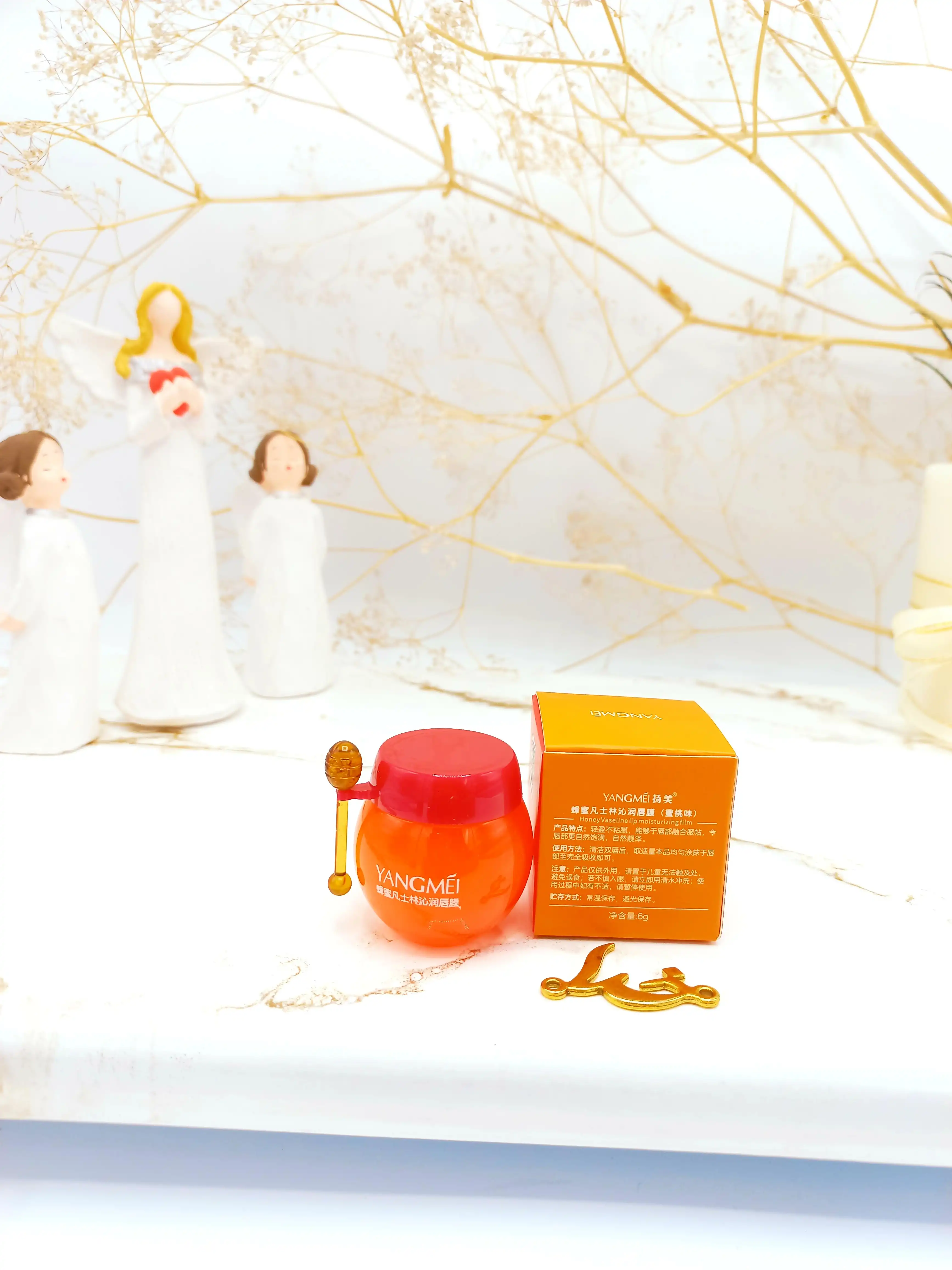 بالم لب کوزه ای مرطوب کننده و آبرسان هلو یانگومی YANGMEI کد YM9071