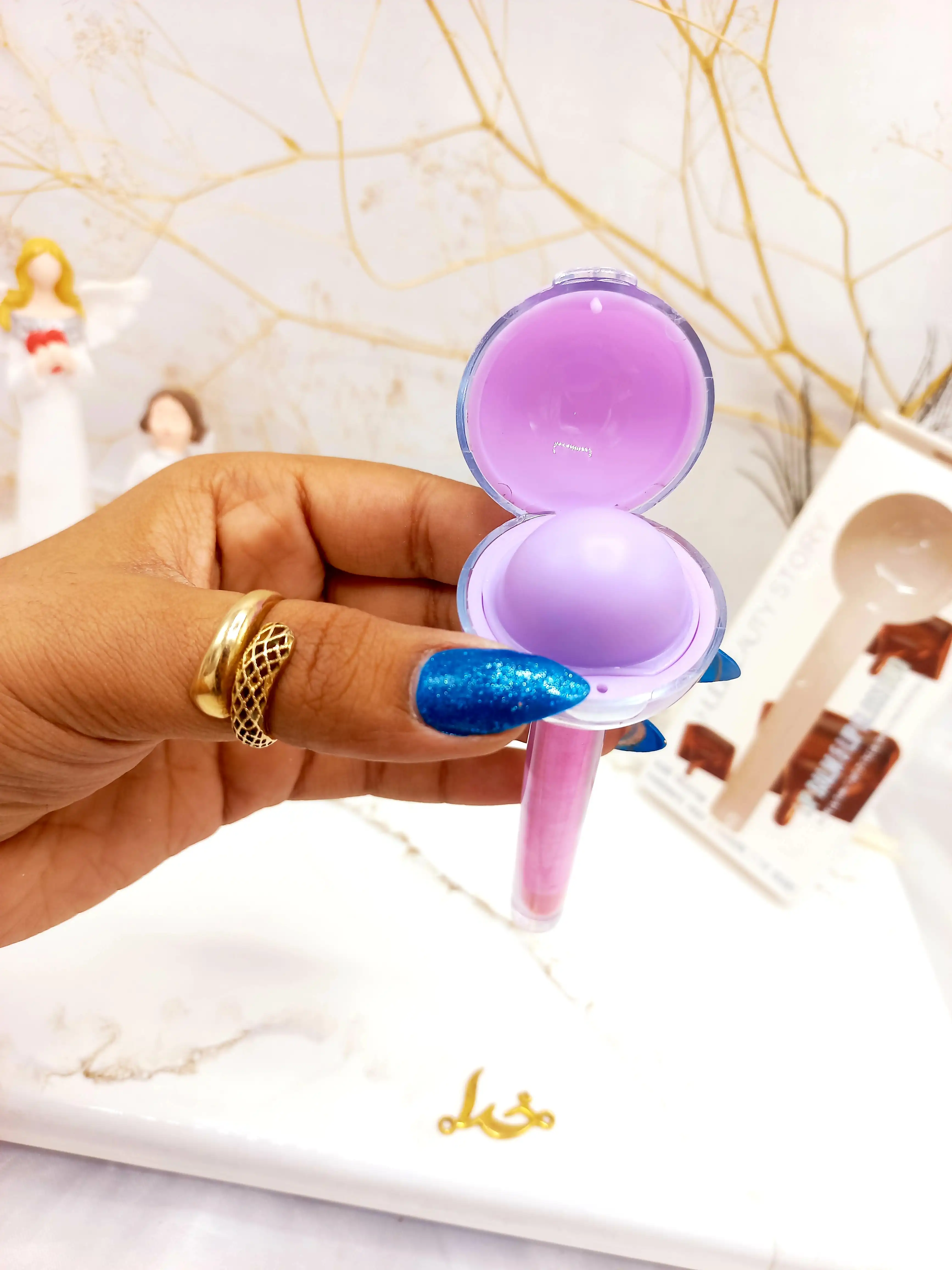 برق لب و بالم لب آبنباتی کاکائو هدا بیوتی استوری HUDA BEAUTY STORY