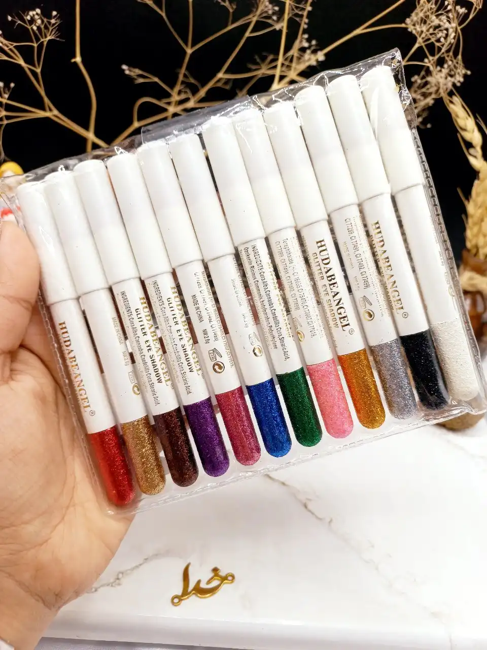 پک رژ مدادی ۱۲ عددی گلیتری برند هدی بانجل HUDABEANGEL پوکه سفید