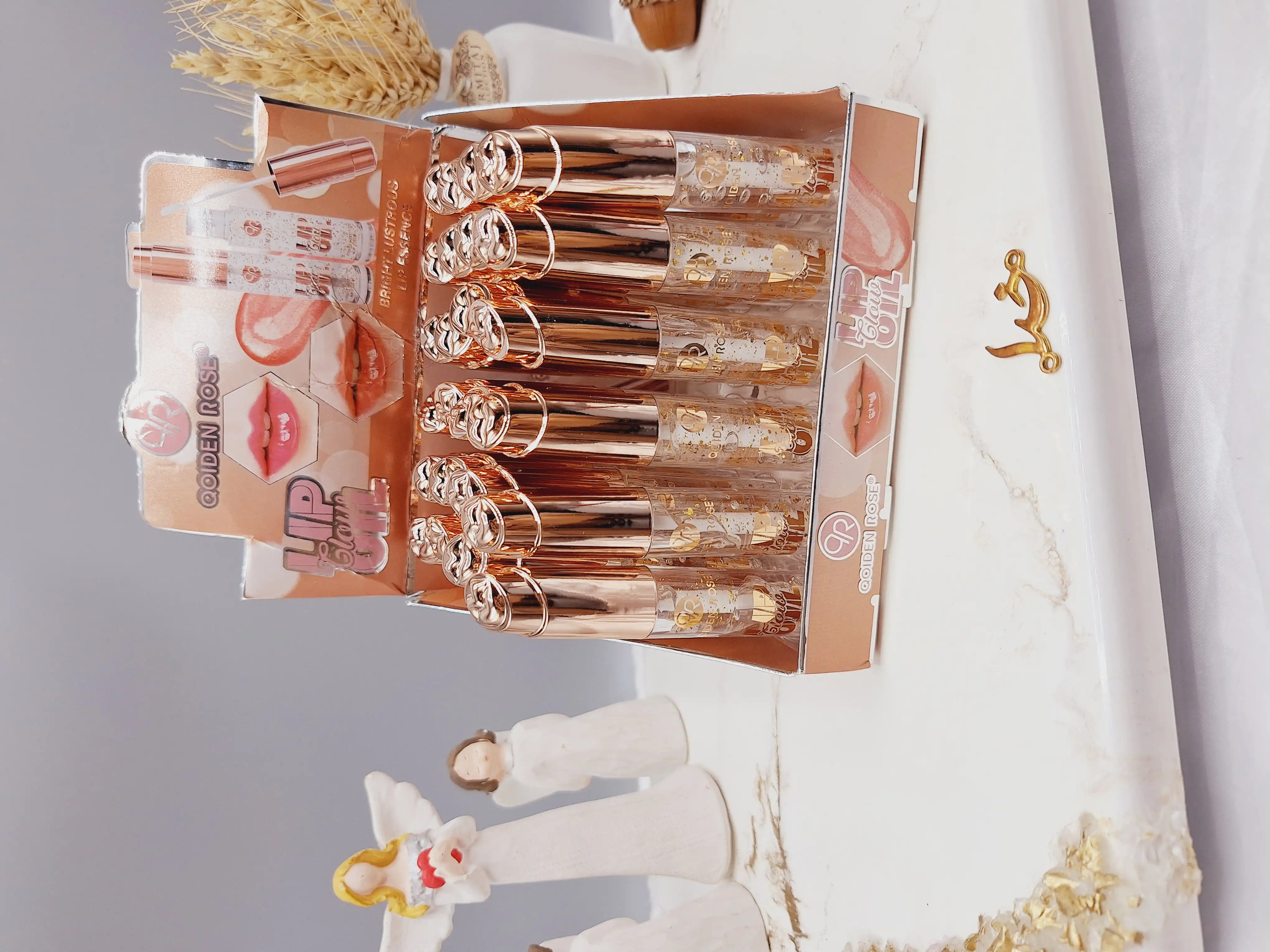 لیپ گلاس ورق طلا طرح لب برند OOIDEN ROSE کد 1348