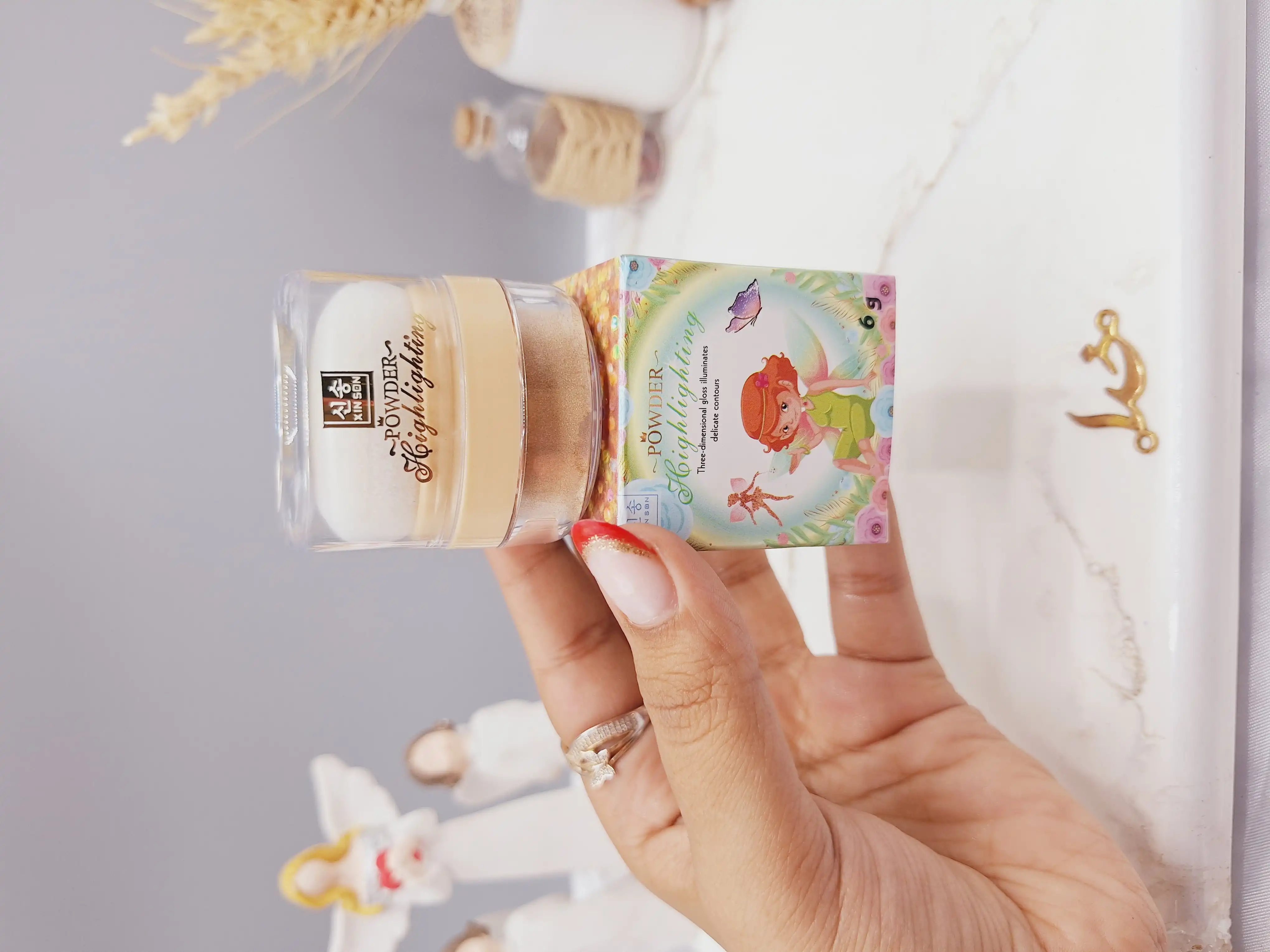 هایلایتر پد دار شاین ریز رنگ طلایی مناسب کل بدن طرح پری برند POWDER کد XS-1096