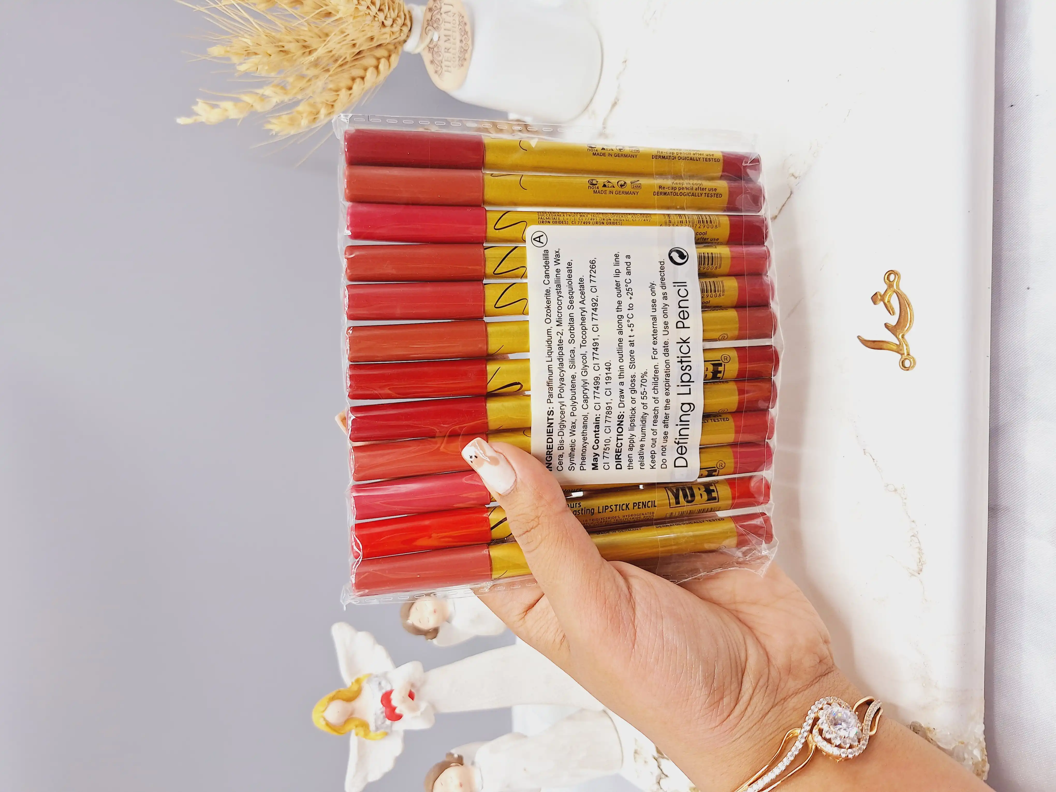 پک 12 تایی رژ مدادی برند YUBE پوکه طلایی کد A