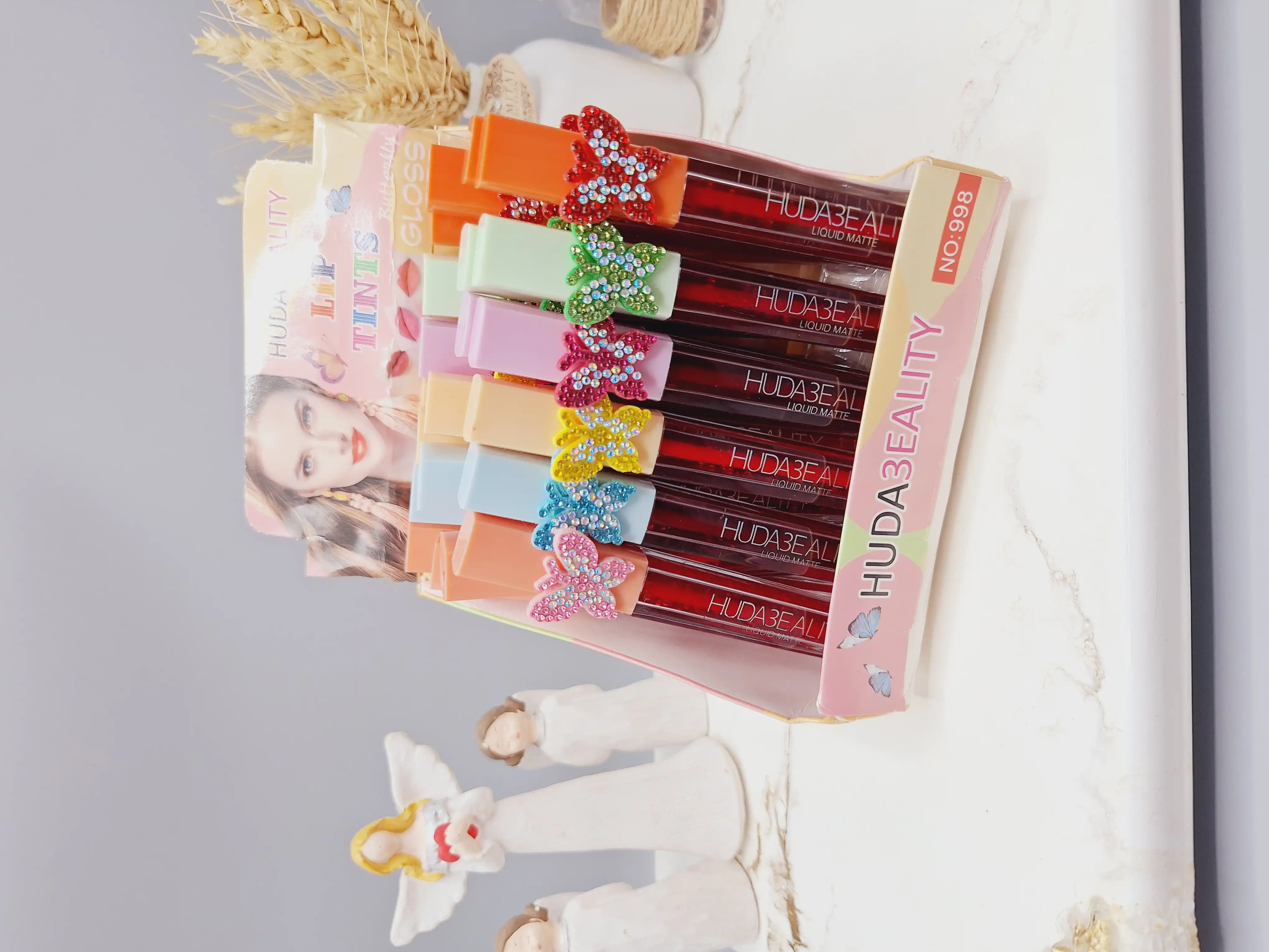 تینت لب پروانه نگینی برند HUDA3EALITY کد 998