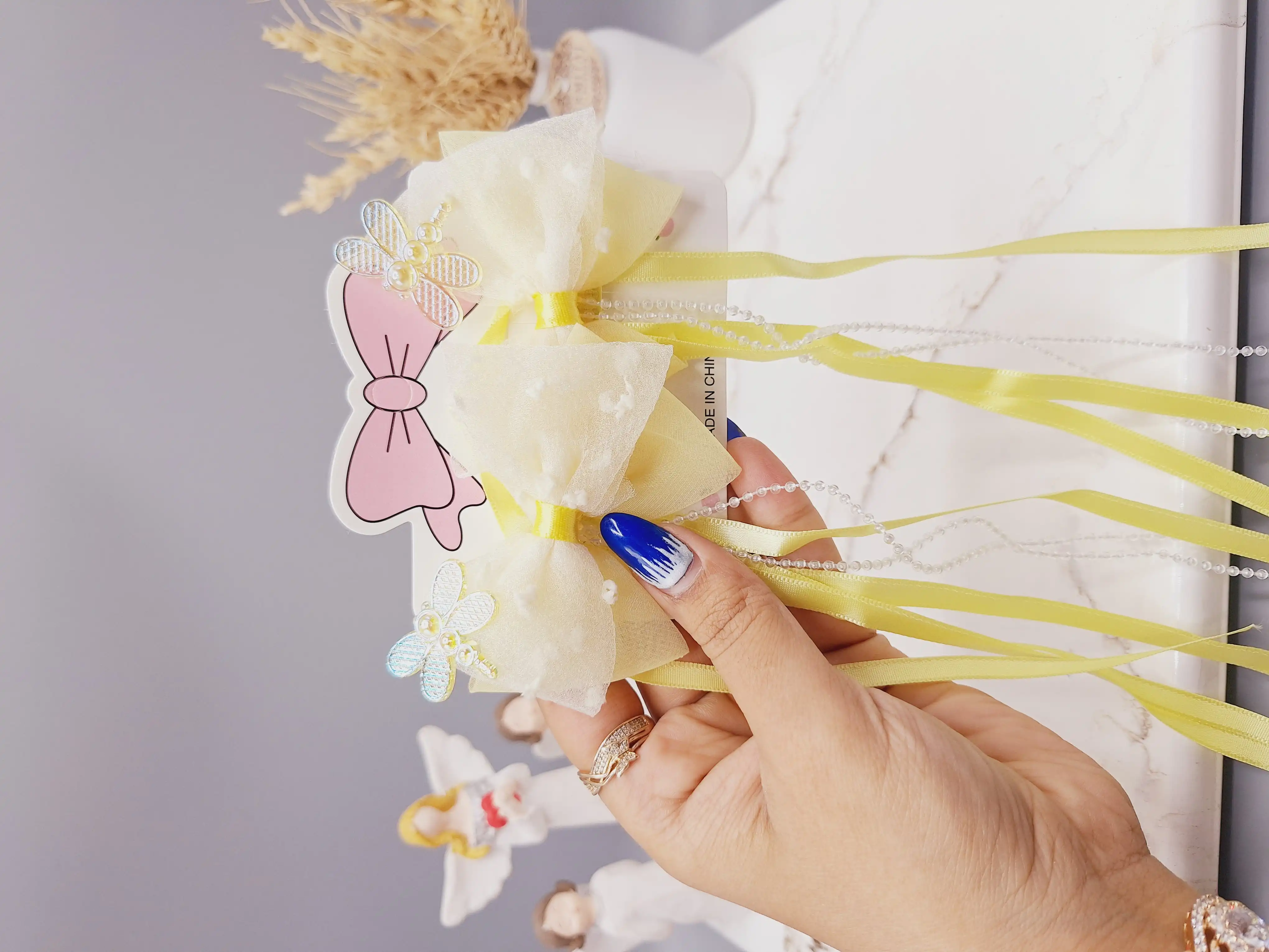 ست 2 تایی گیره مو پاپیونی همراه با آویز نواری و نگین دار