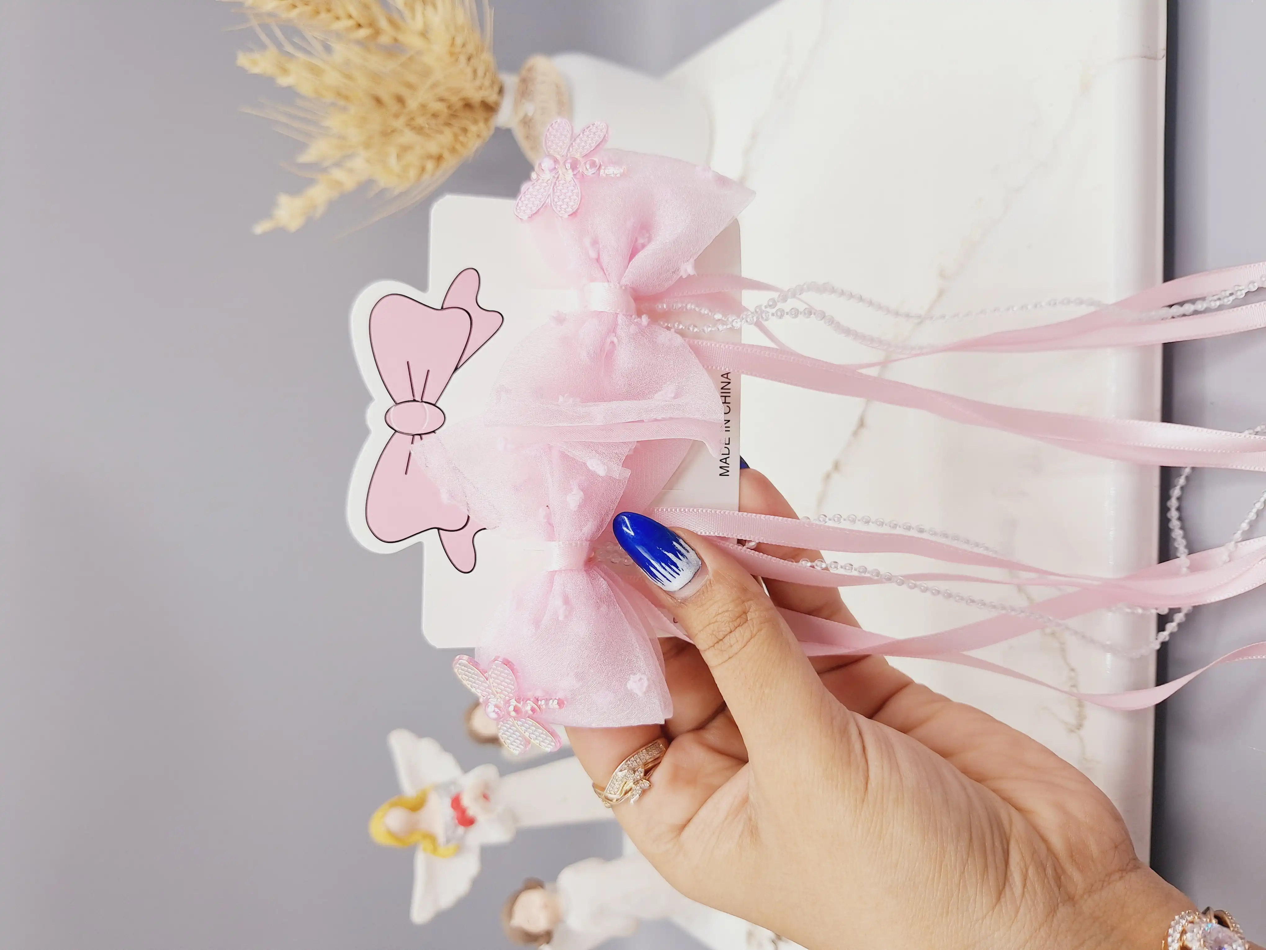 ست 2 تایی گیره مو پاپیونی همراه با آویز نواری و نگین دار