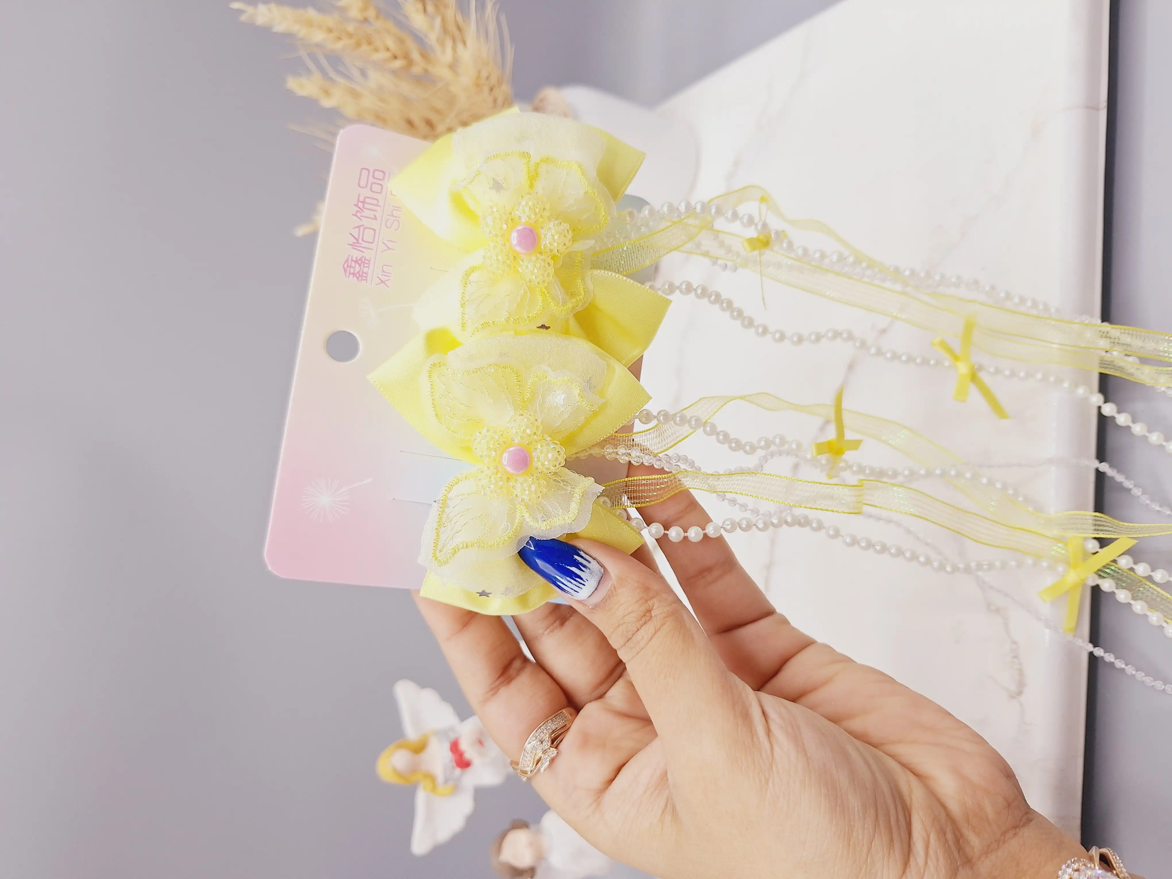 ست 2 تایی گیره مو پاپیونی و گل  همراه با آویز نواری و نگین دار