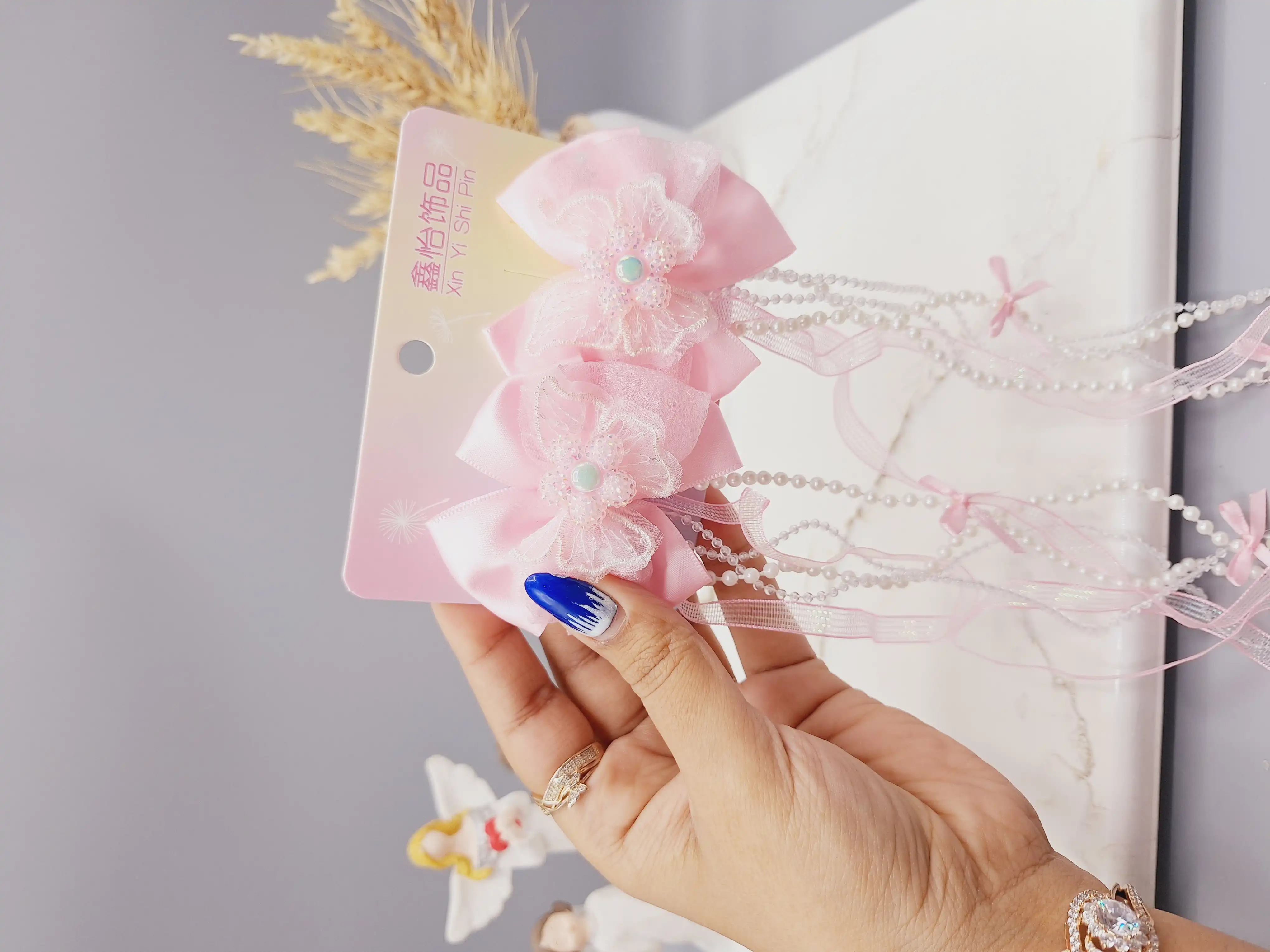 ست 2 تایی گیره مو پاپیونی و گل  همراه با آویز نواری و نگین دار