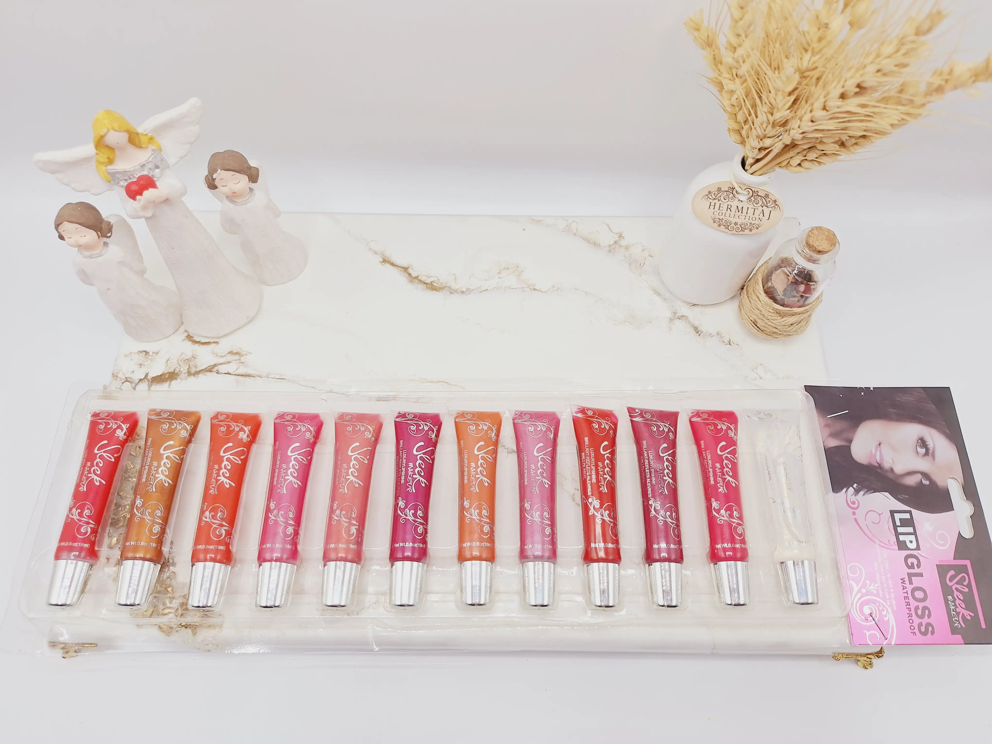 پک 12تایی لیپ گلاس و نرم کننده لب برند Seek