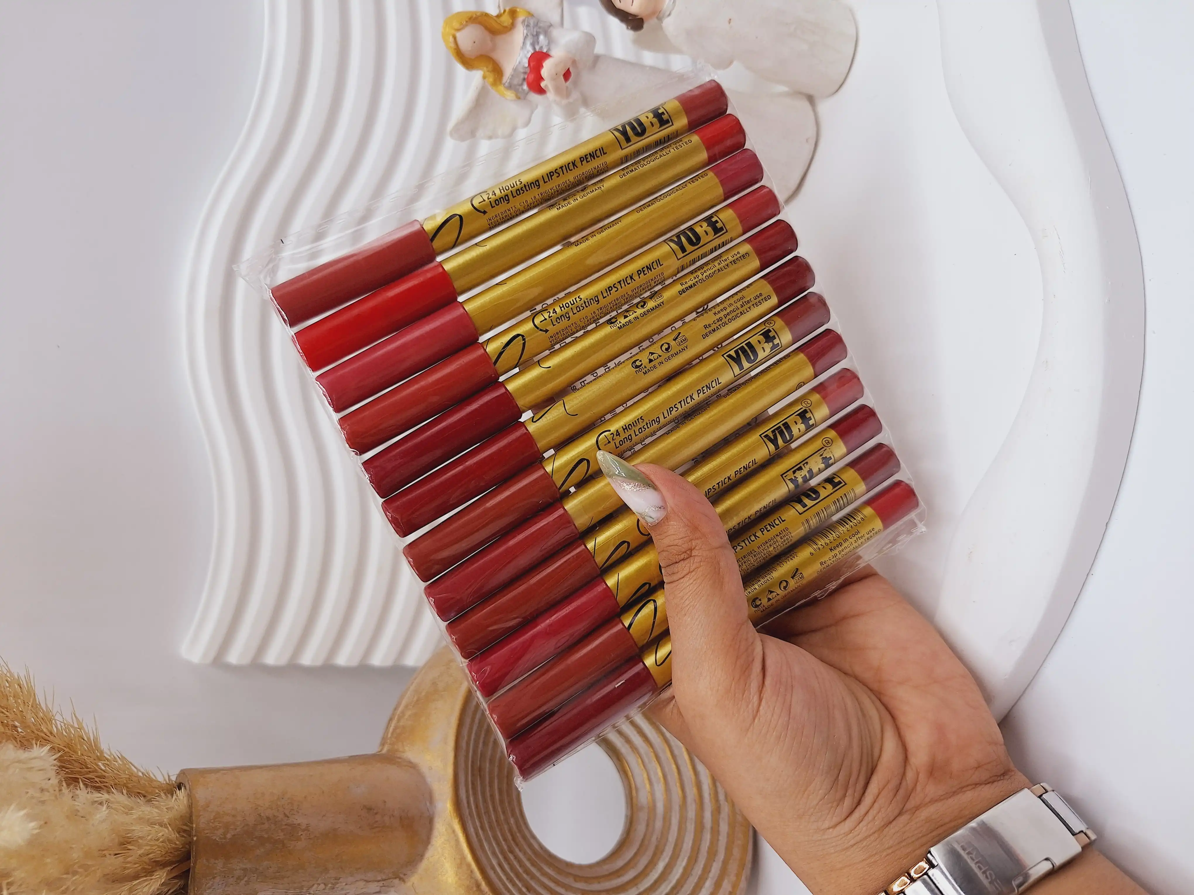 پک 12 تایی رژ مدادی برند YUBE پوکه طلایی کد B