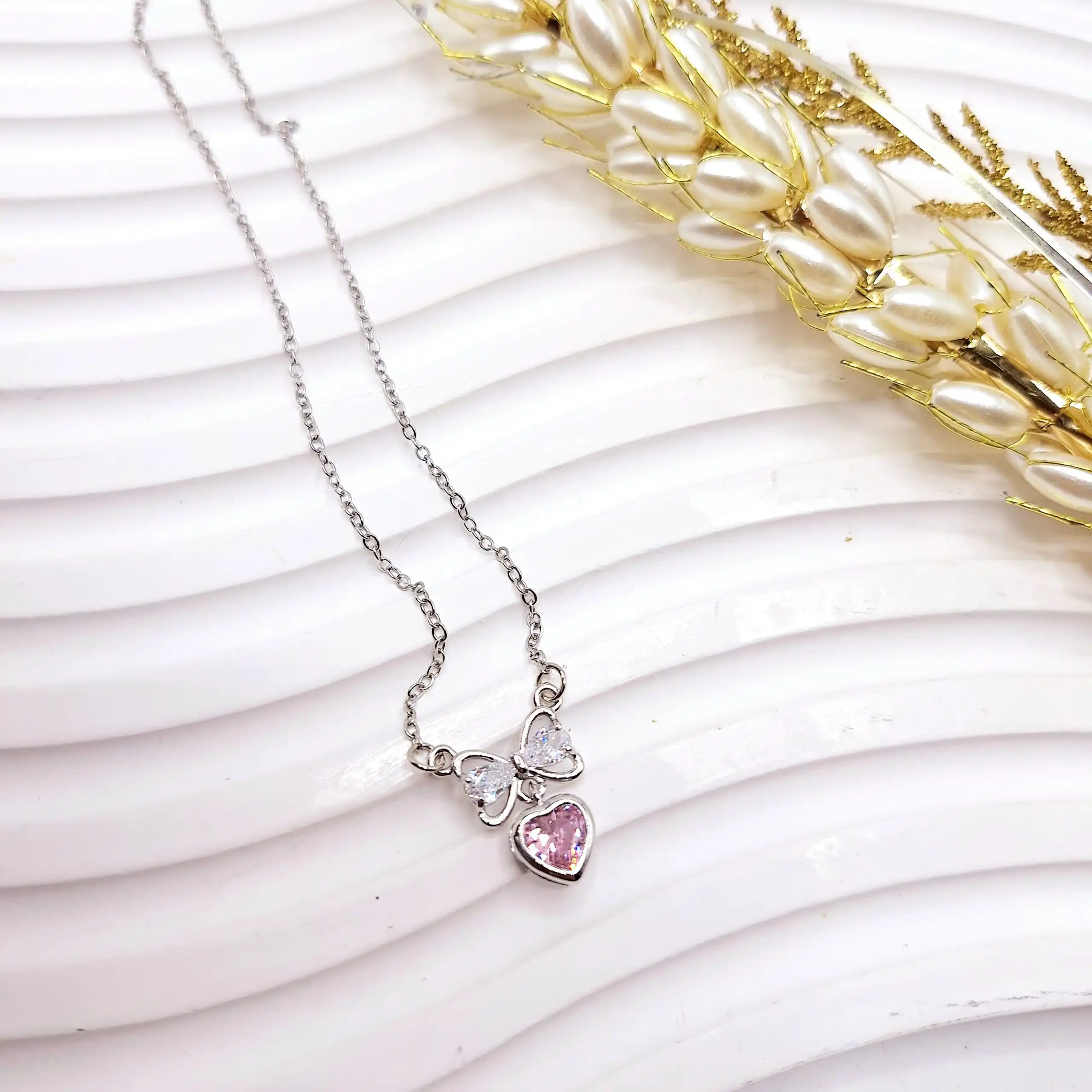 گردنبند زنانه جواهری قلب و پاپیون صورتی استیل