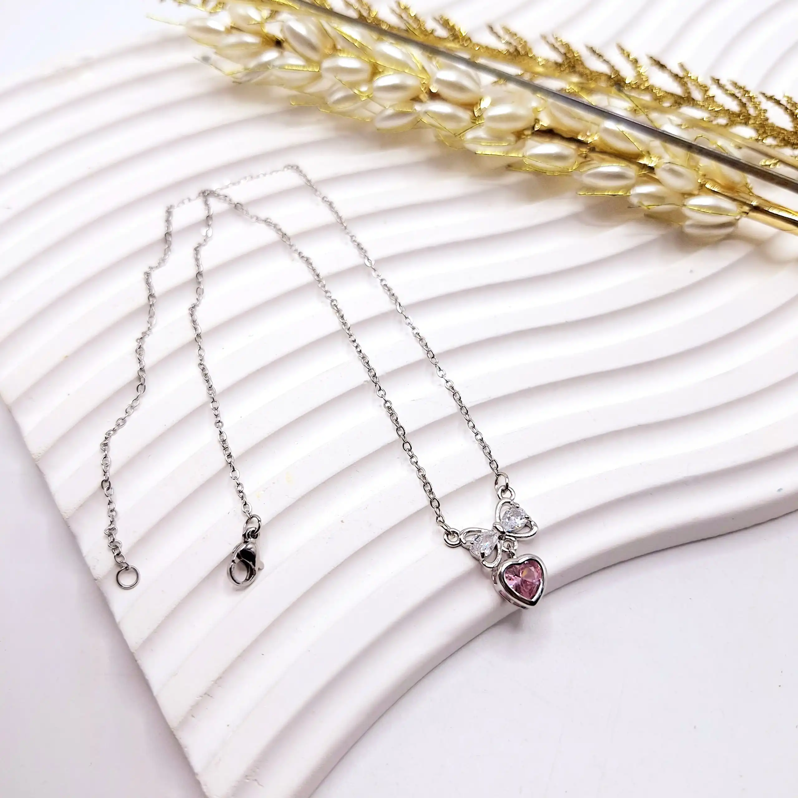 گردنبند زنانه جواهری قلب و پاپیون صورتی استیل