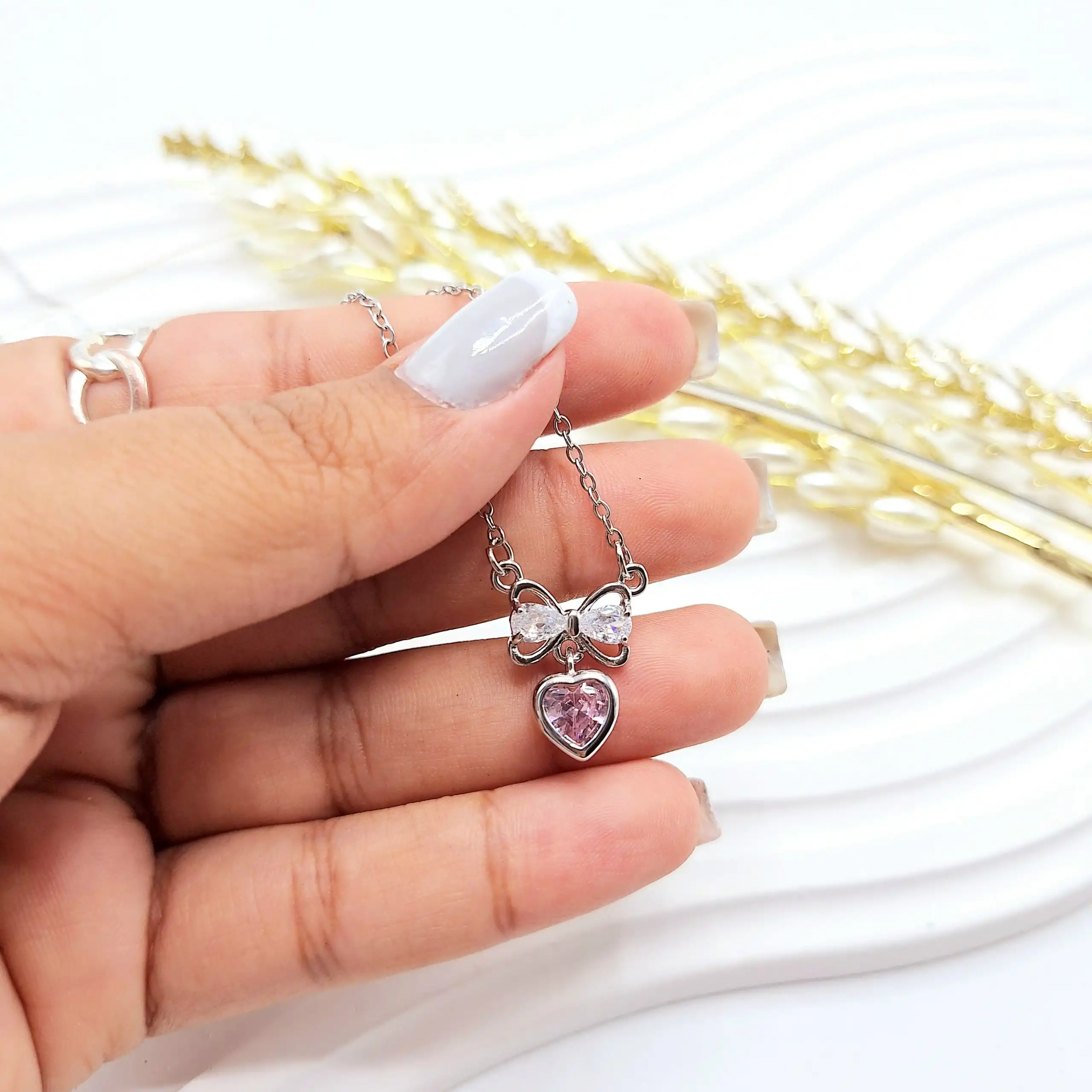 گردنبند زنانه جواهری قلب و پاپیون صورتی استیل