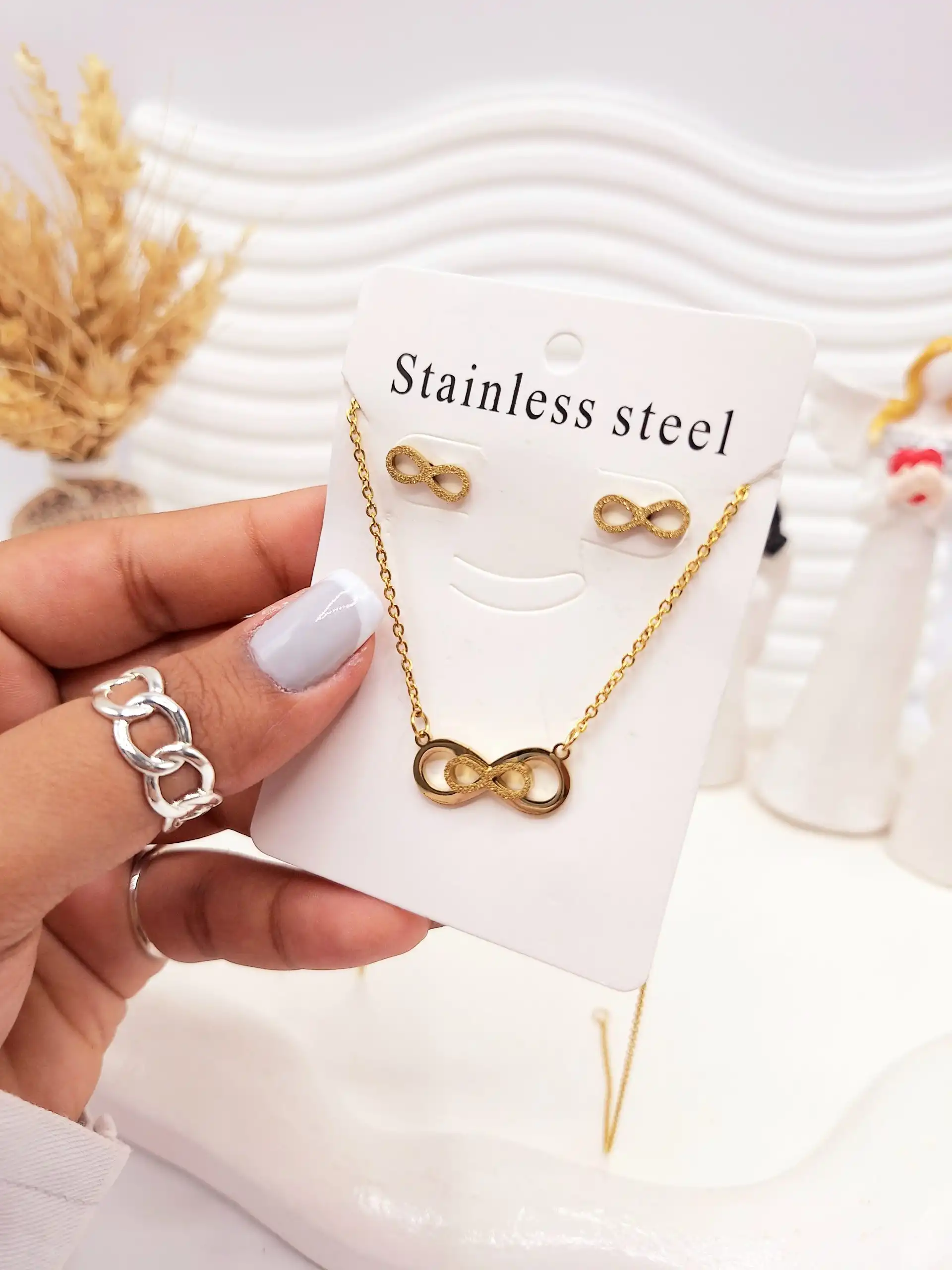 ست گوشواره و گردنبند طرح بی نهایت طلایی استیل