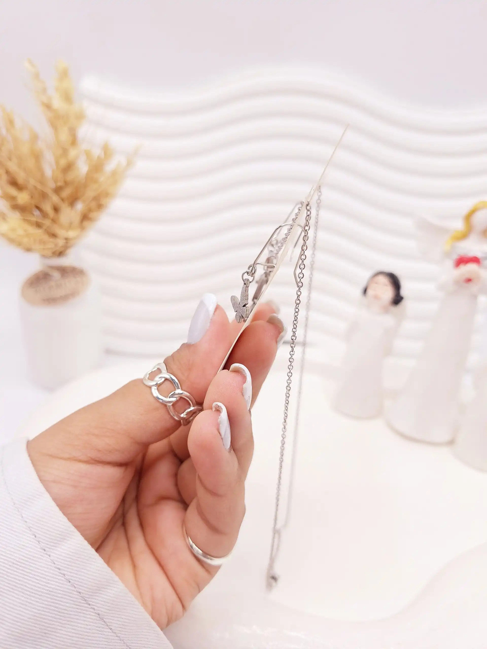 ست گوشواره و گردنبند طرح پروانه مخرج کاری نقره ای استیل