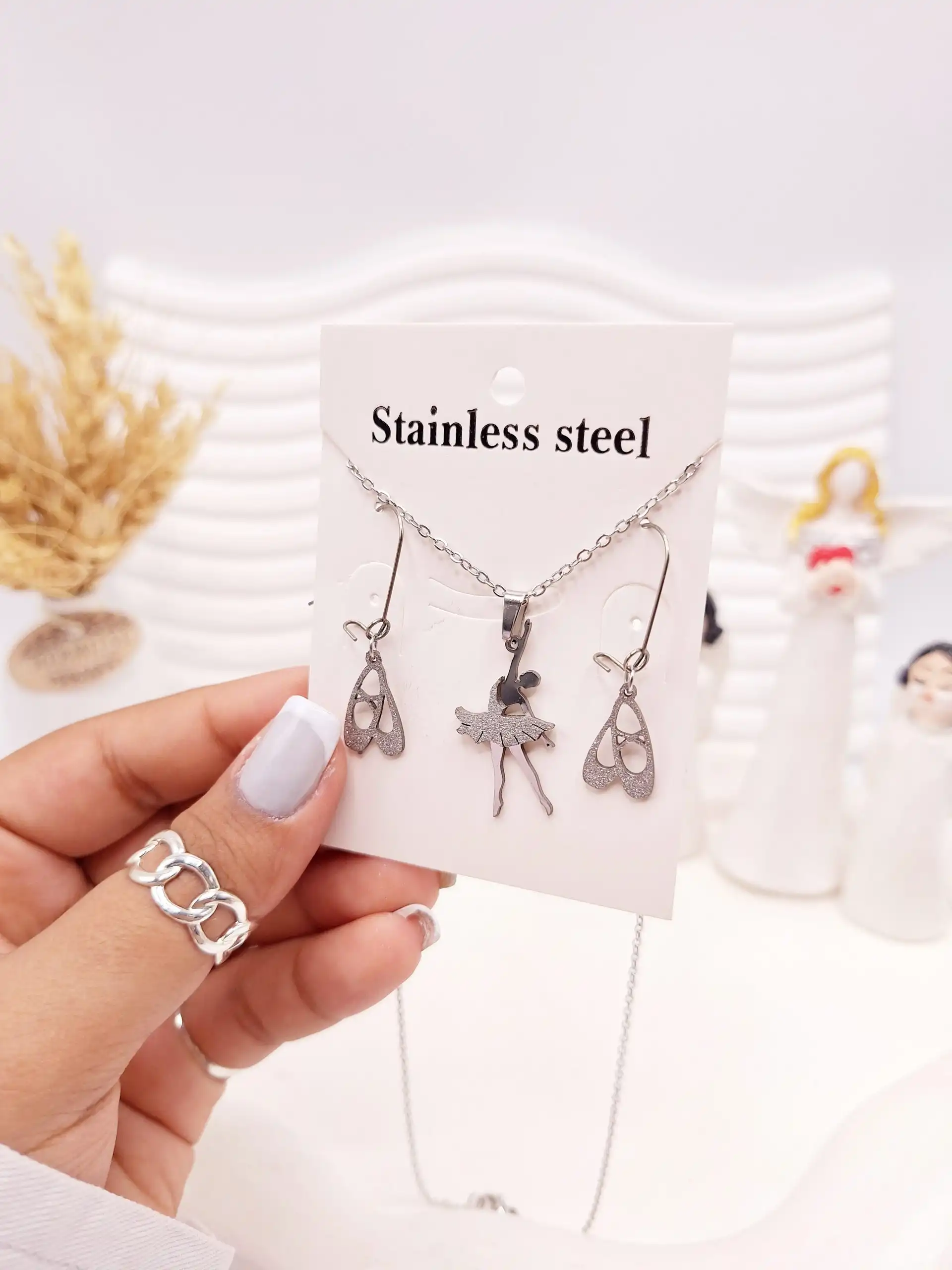 ست گوشواره و گردنبند طرح بالرین نقره ای استیل