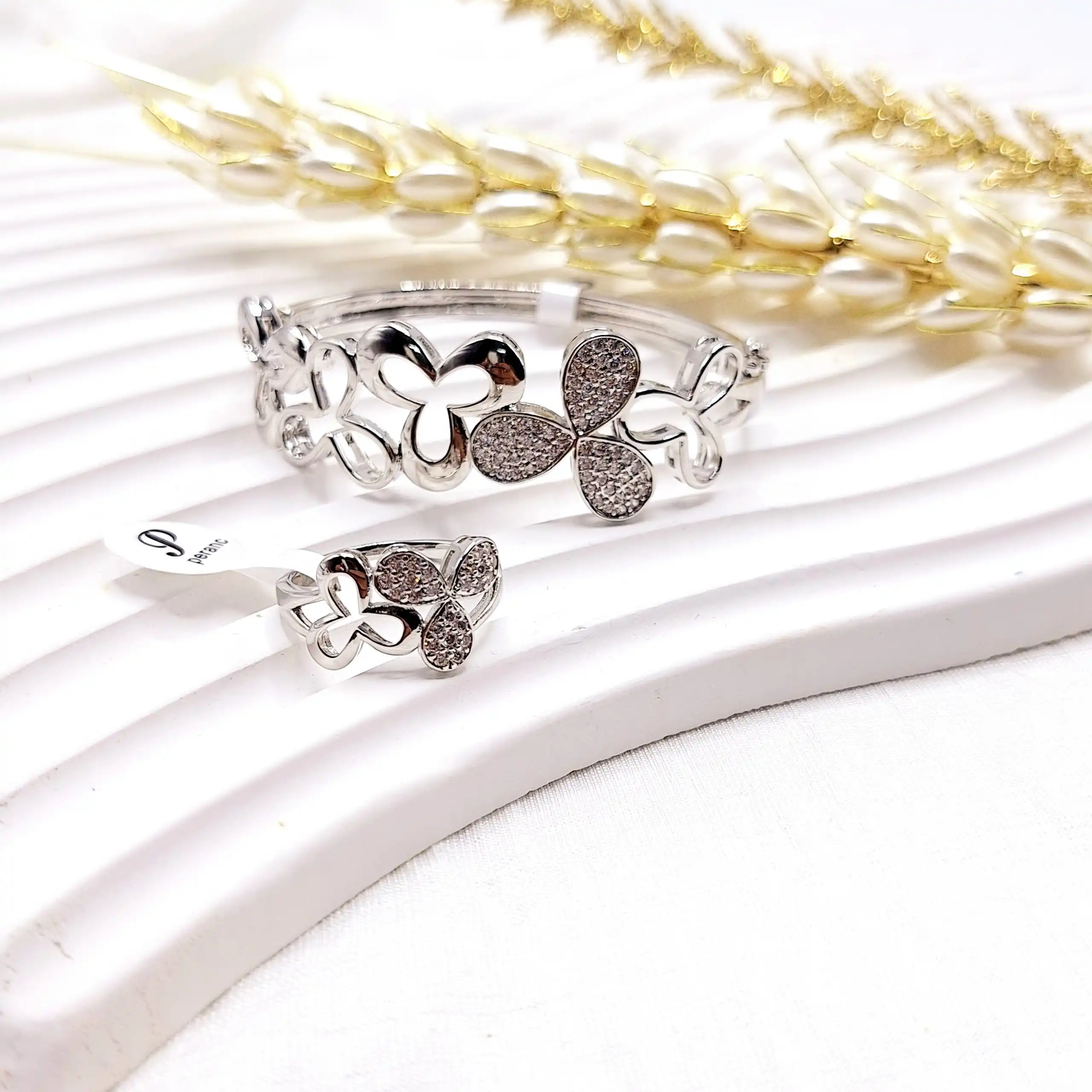 ست انگشتر و دستبند گلبرگ نقره ای استیل