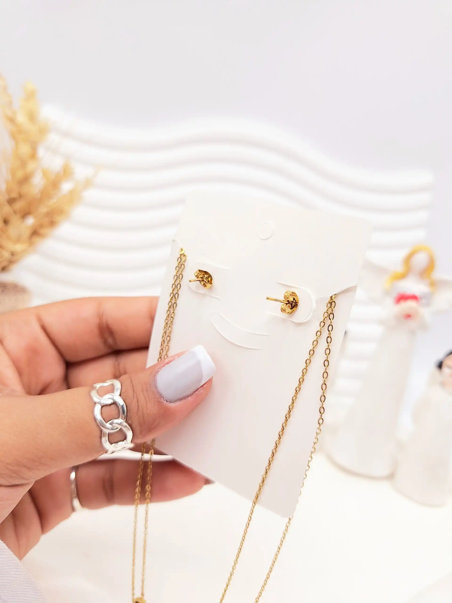 ست گوشواره و گردنبند دو لاین برگ و آویز نگین دار رنگ طلایی استیل