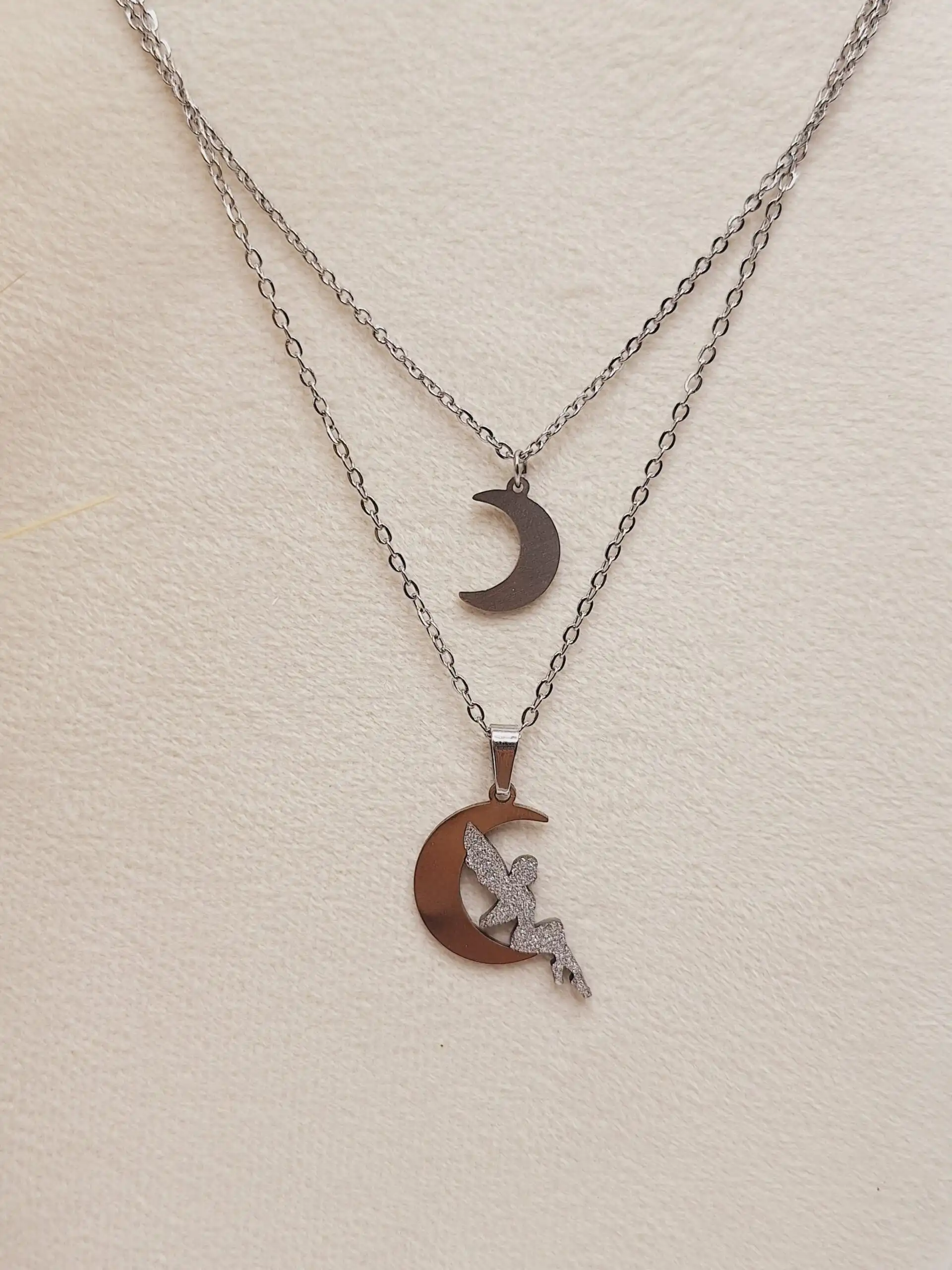 ست گوشواره و گردنبند 2 لاین طرح فرشته و ماه نقره ای استیل