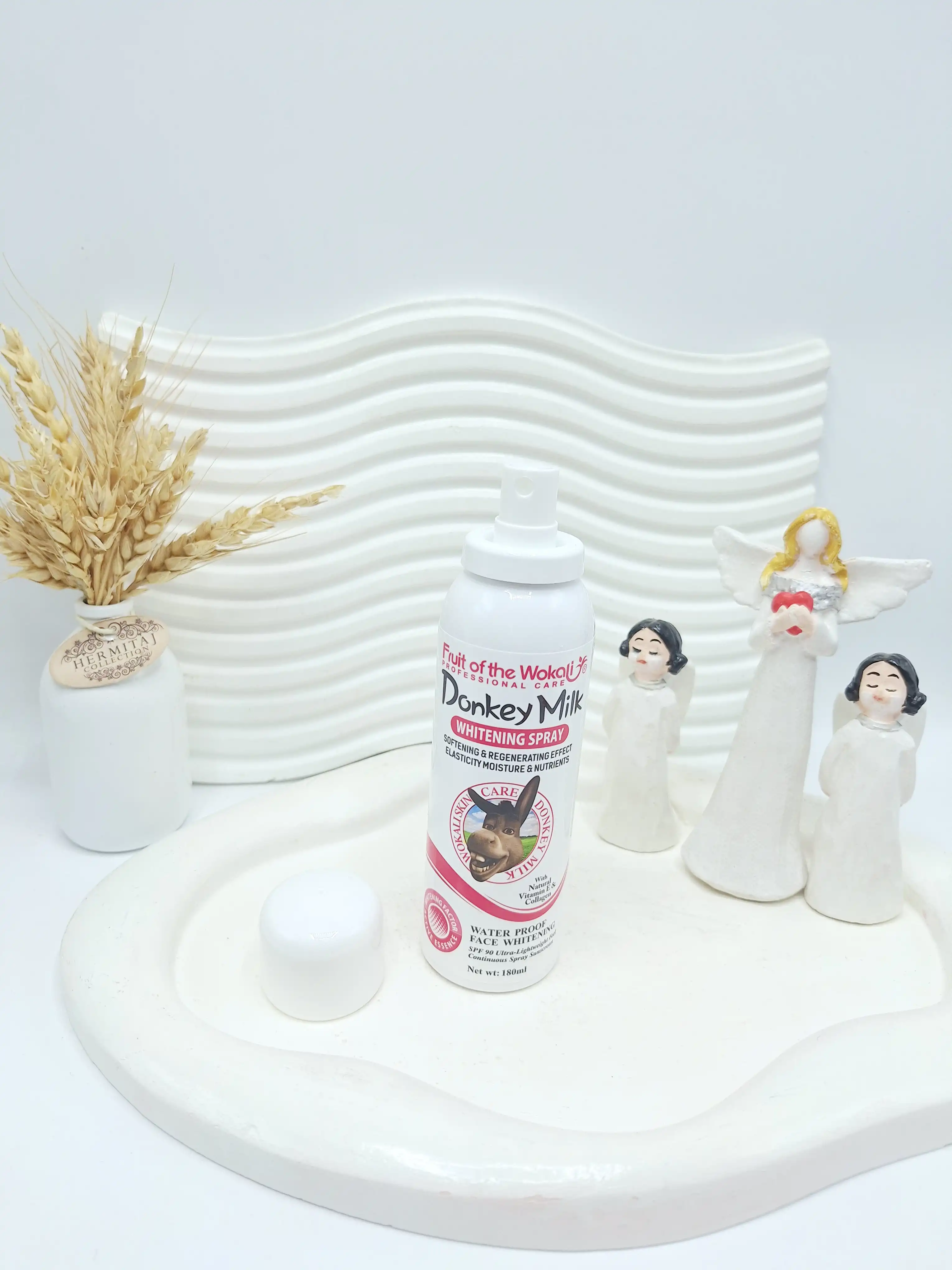 اسپری سفید کننده حاوی ضد آفتاب شیر الاغ برند وکالی اصلی کد 3048 (جلد صورتی)